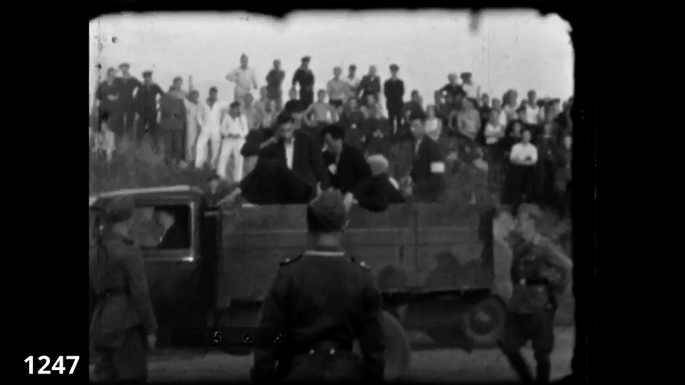 Screenshot from the Wiener Film mass execution in Liepaja 1942 fc 1247 - Jews being forced off a Lorry for execution